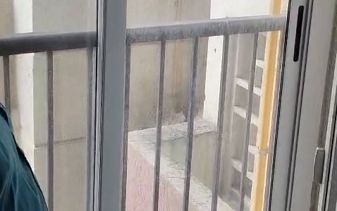White aluminium sliding window with clear glass panel and handle